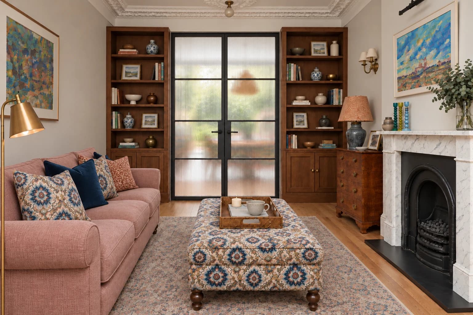 Family residence in Epsom Downs: Bespoke built-in bookcases in the living room.