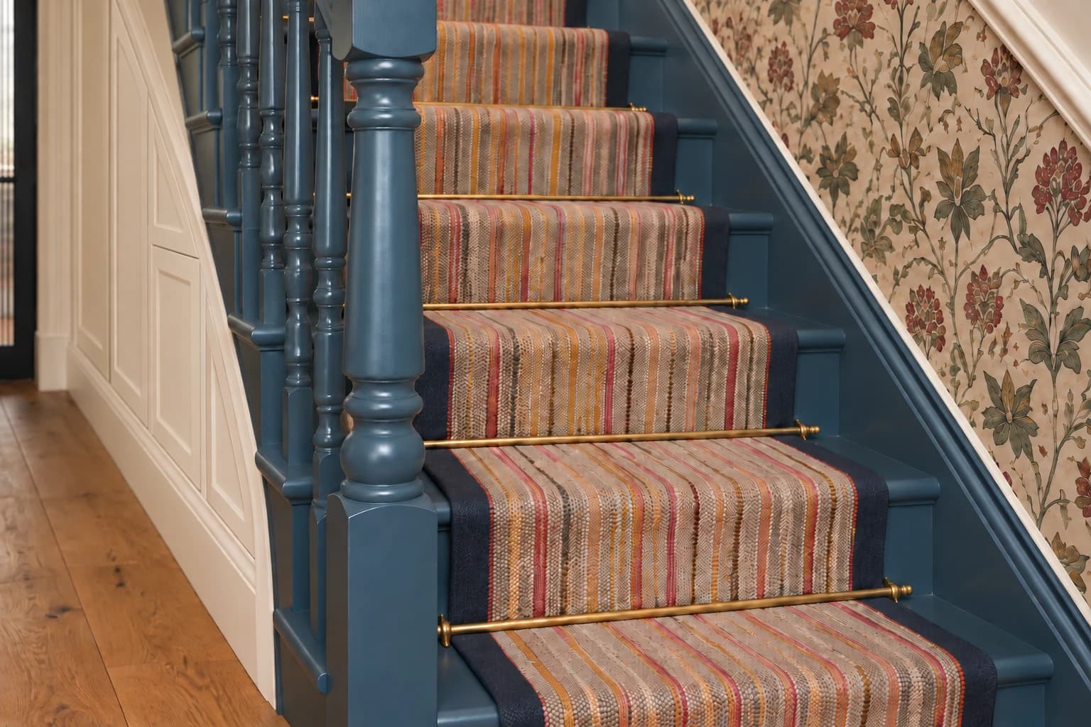 Family residence in Epsom Downs: Ground-floor staircase with fitted understairs storage.