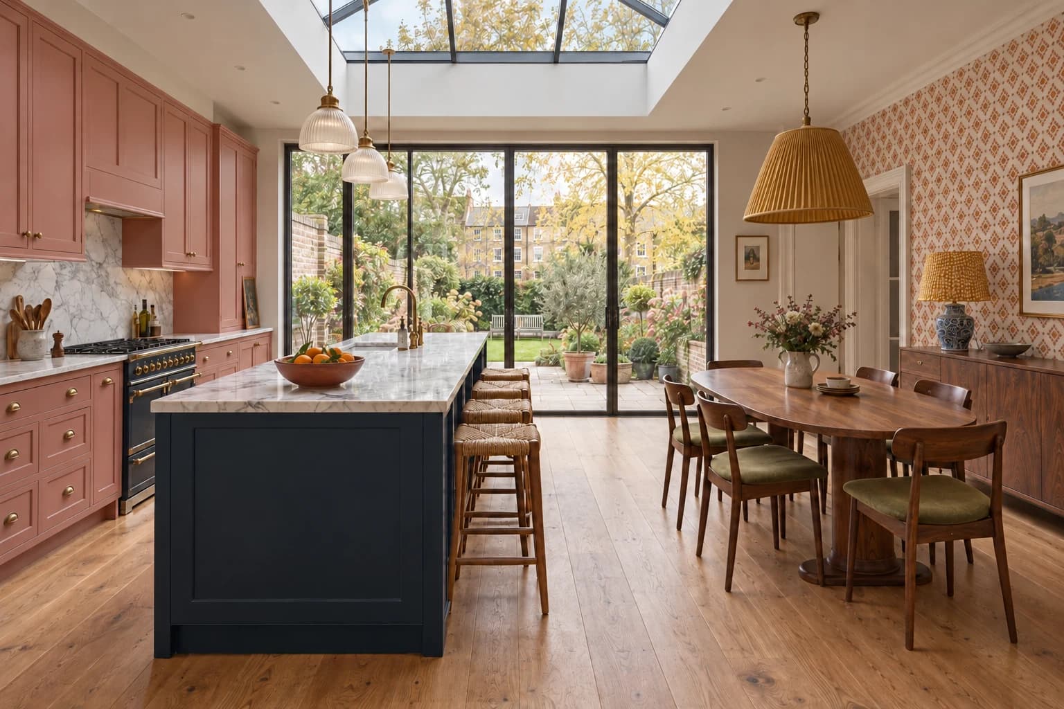 Family residence in Epsom Downs: Kitchen and dining space with fitted cabinetry and an island.