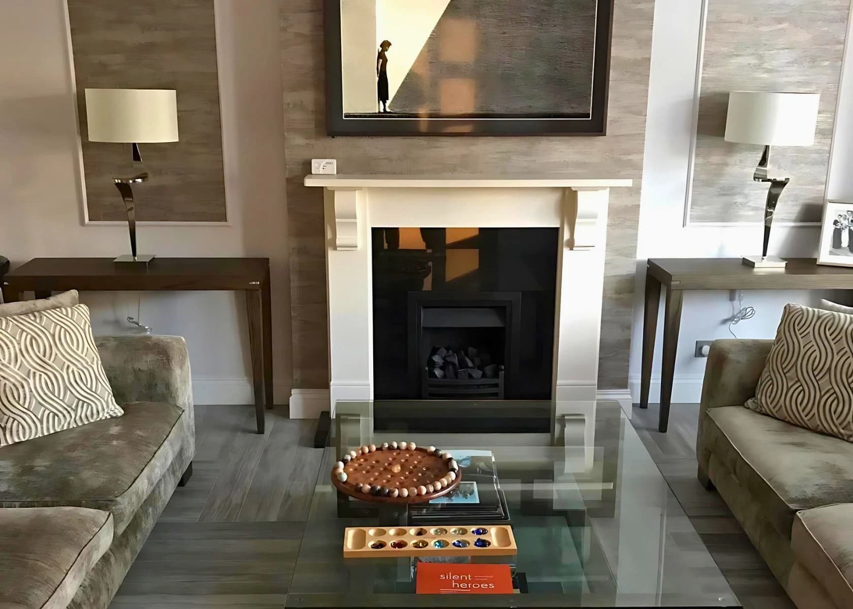 Downage, Finchley: Living-room seating arranged around the fireplace.