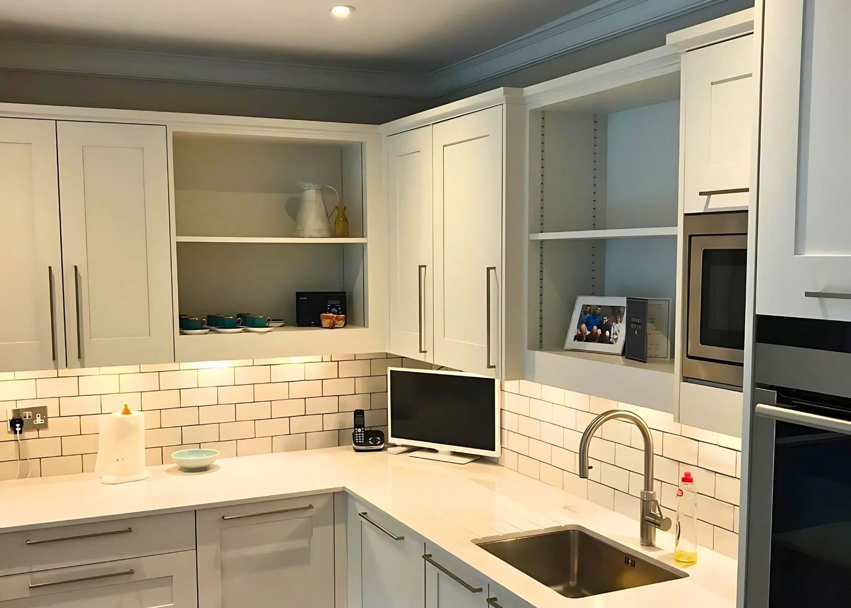 Downage, Finchley: Utility-room cabinetry, worktop and sink.