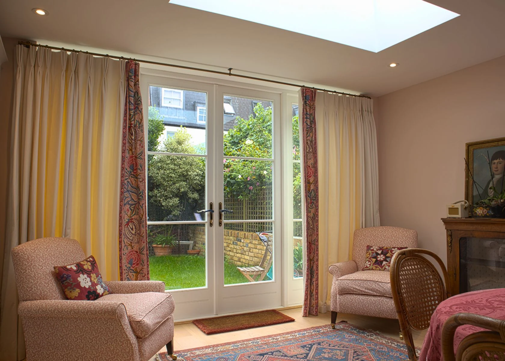 Garden-facing sitting room beneath a large rooflight at Faroe Road.