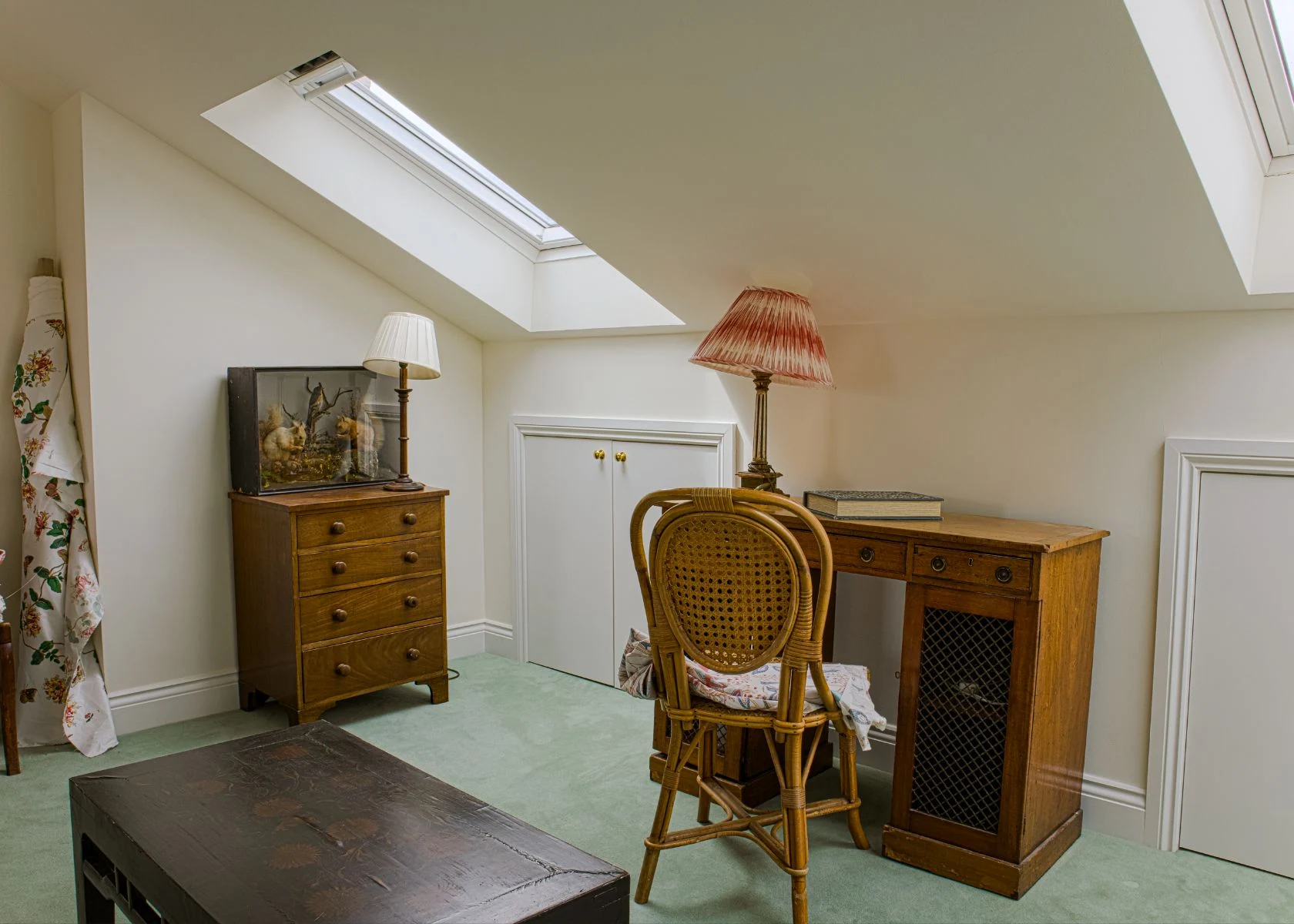 Faroe Road: A roof-level room with sloping ceilings and a roof window.