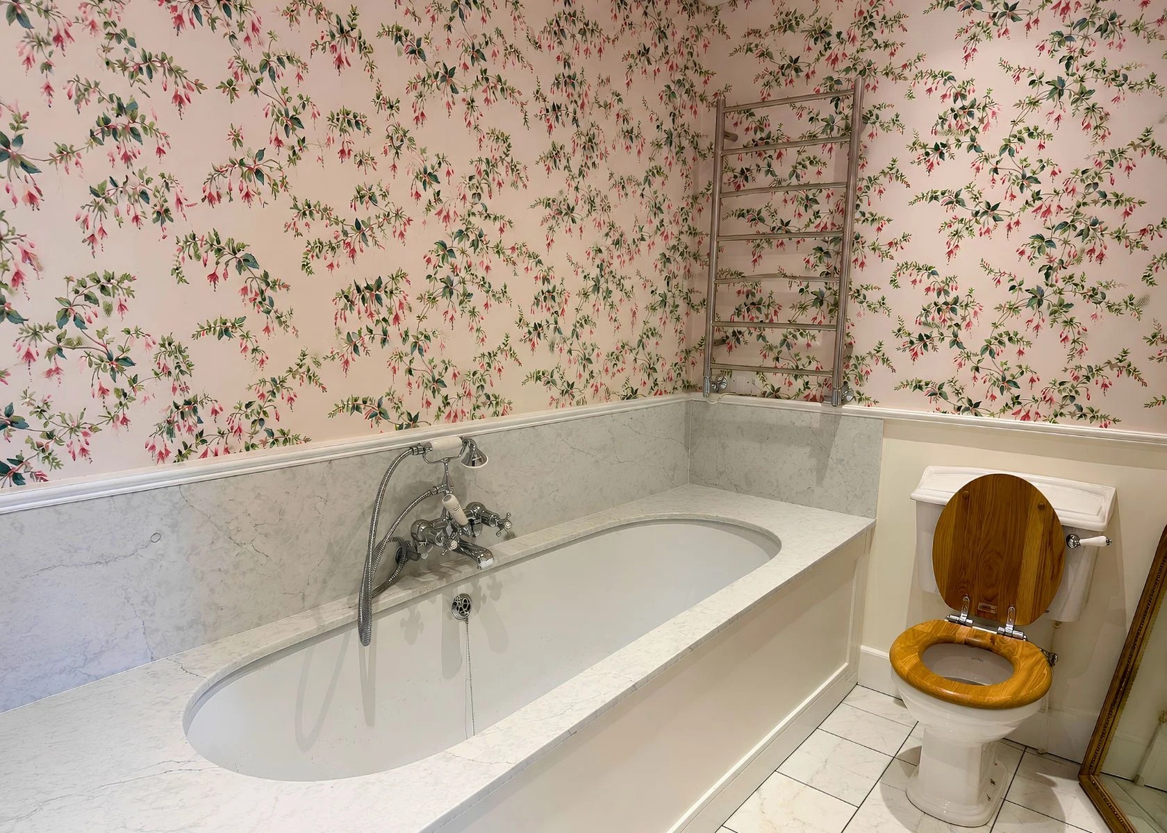 Faroe Road: Bathroom layout, bath surround and wall finishes.