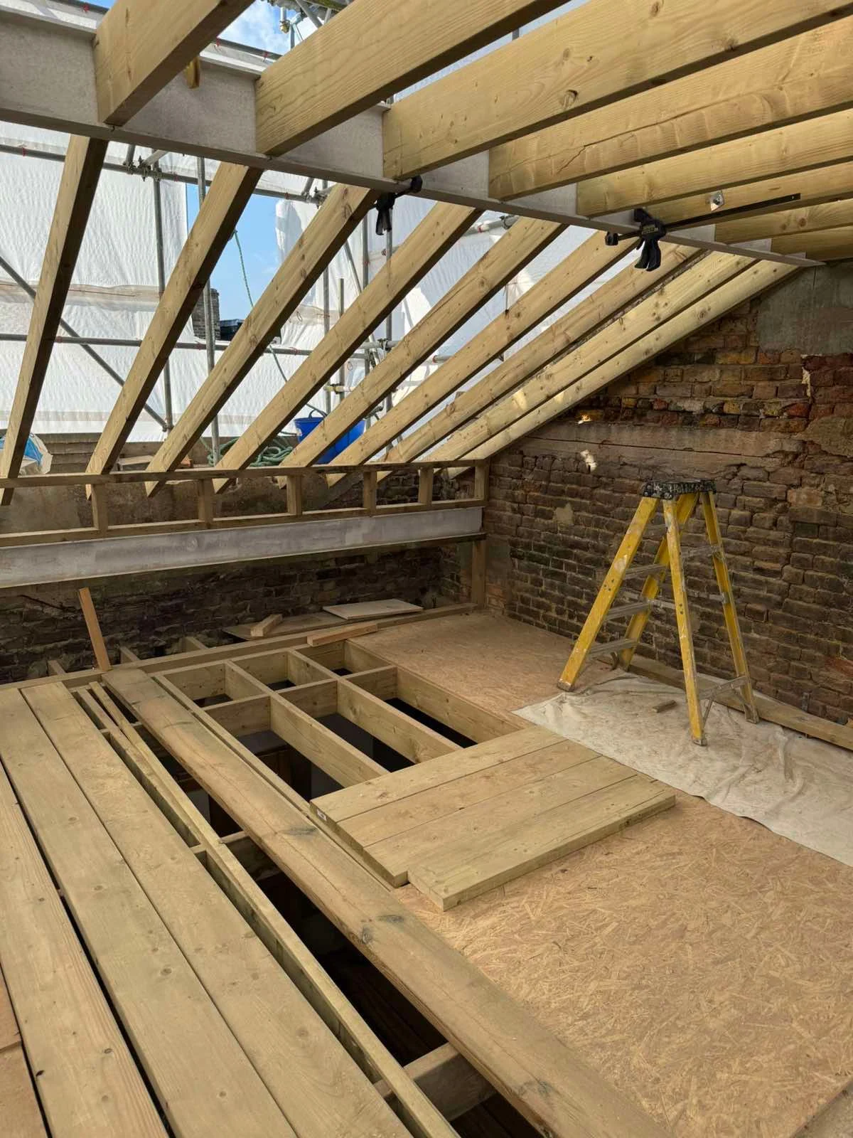 Faroe Road: Construction stage: timber floor and roof framing.