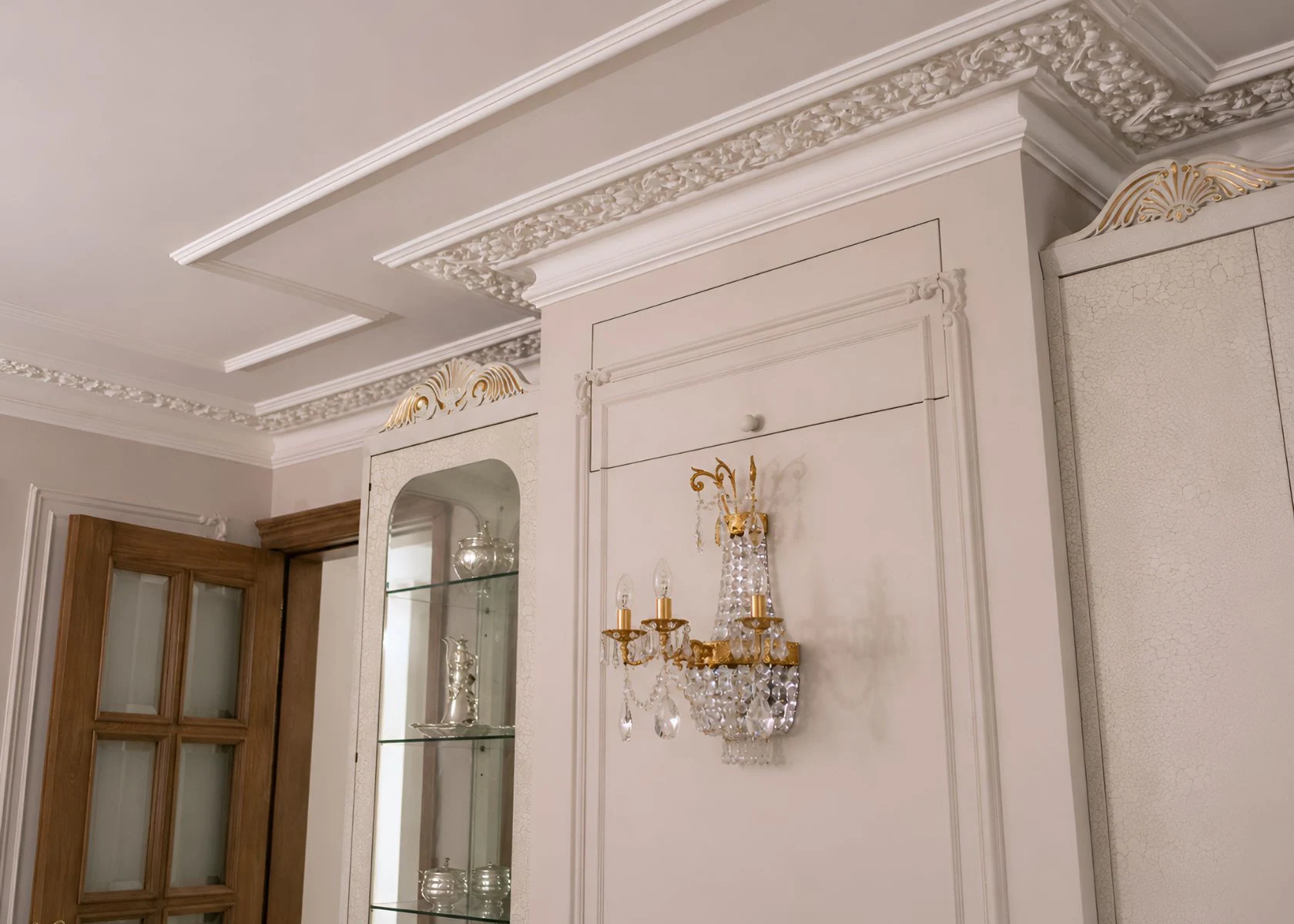 Queen Elizabeth: Ceiling cornice and fitted-cabinet junctions.