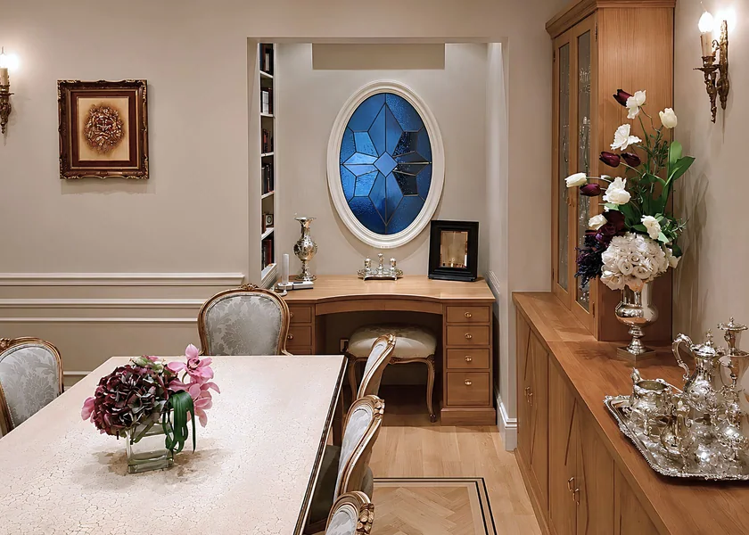 Dining room with bespoke cabinets and an oval window at Rostrevor Avenue.