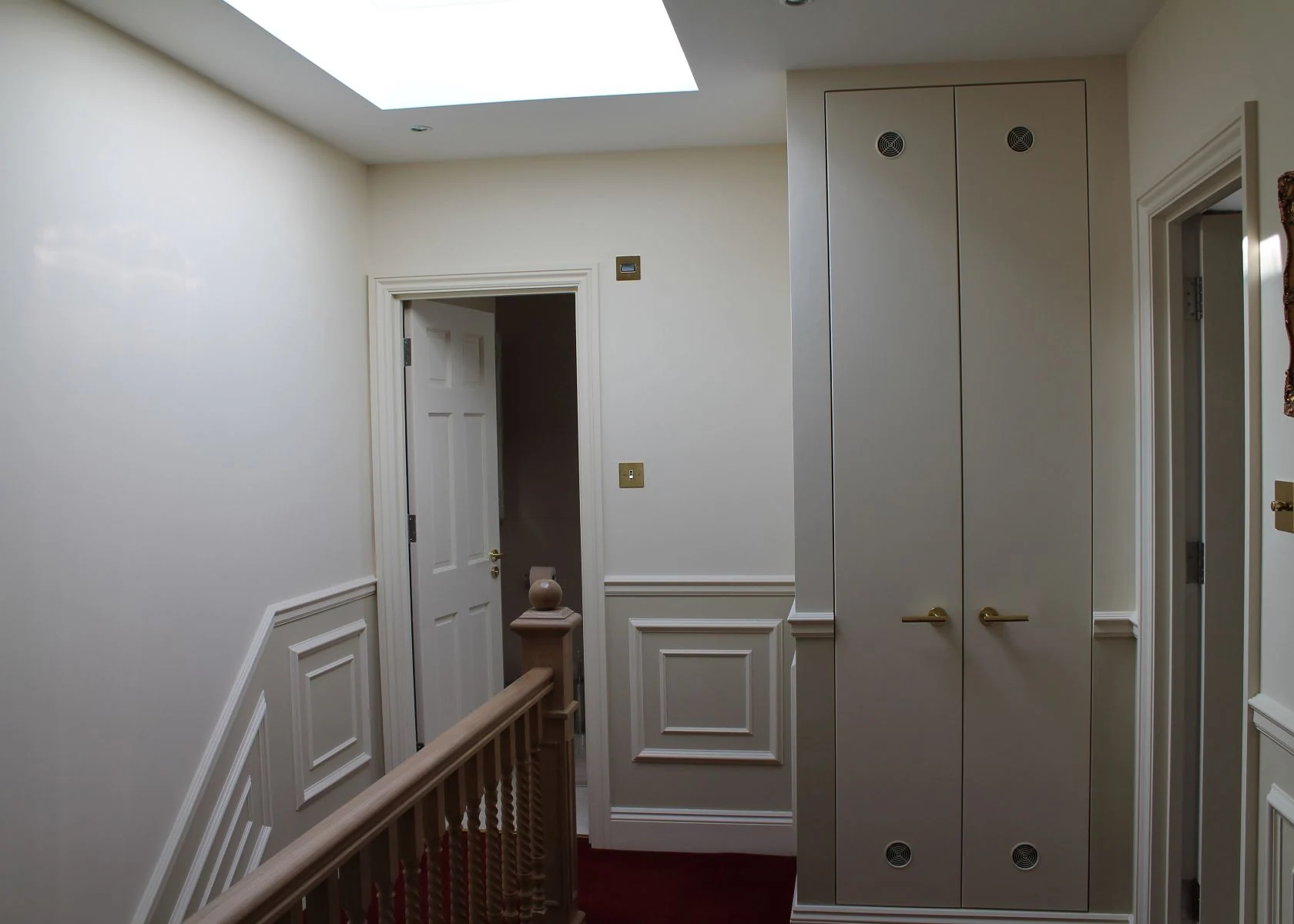 Rostrevor Avenue: A rooflight above the landing and fitted storage.