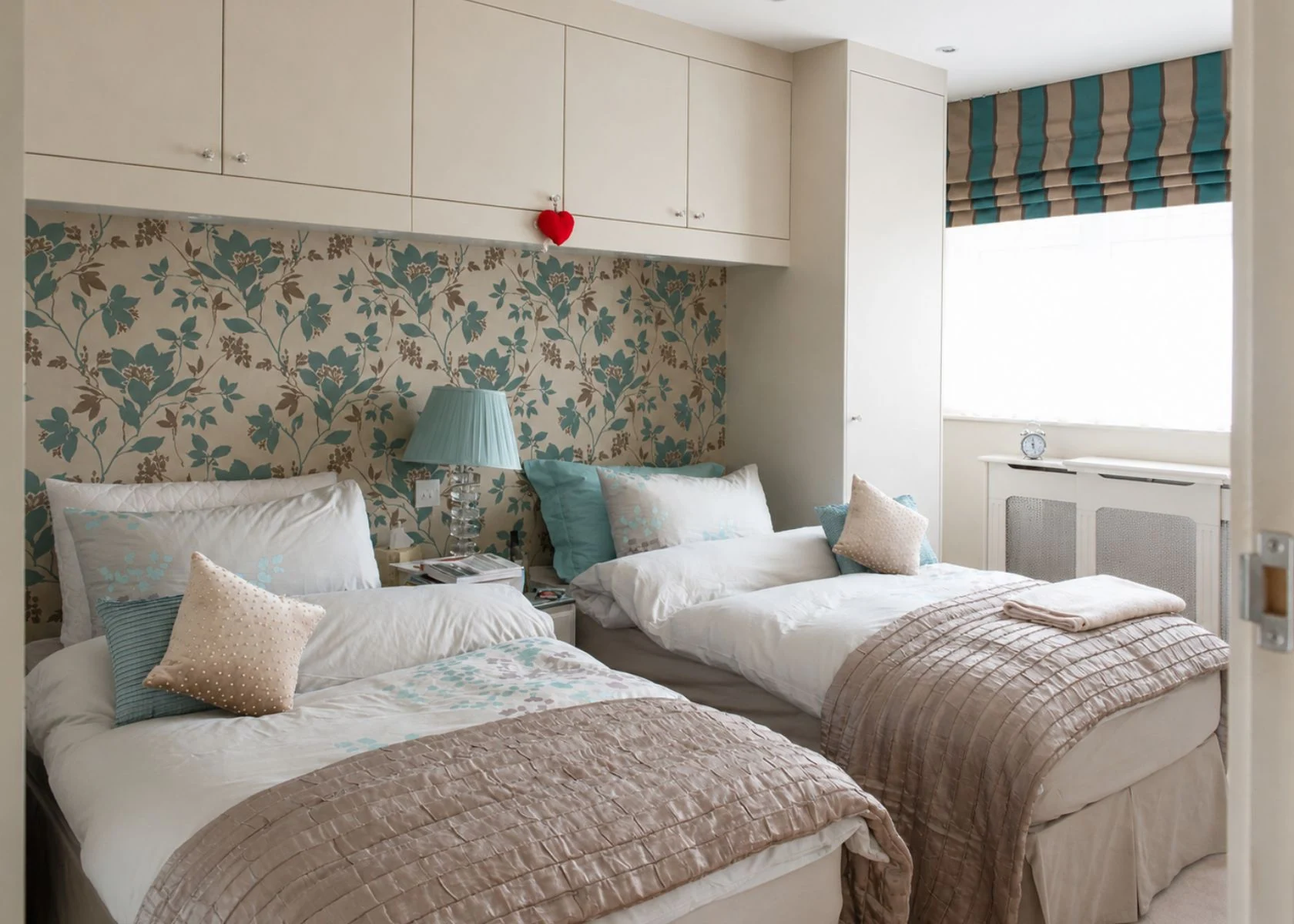 Rostrevor Avenue: Bedroom storage fitted above and beside the beds.