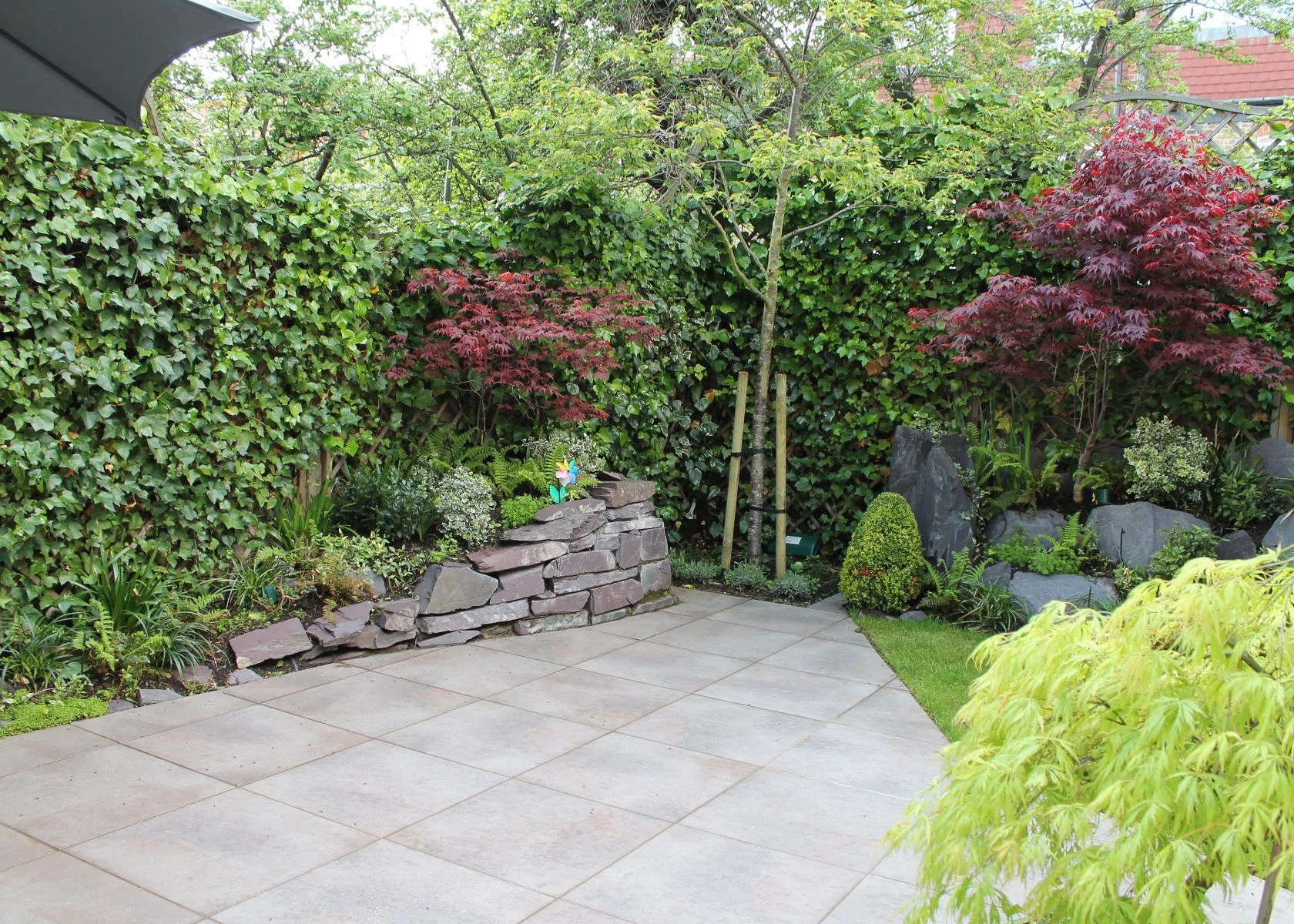 Rostrevor Avenue: The paved terrace and planted garden edge.
