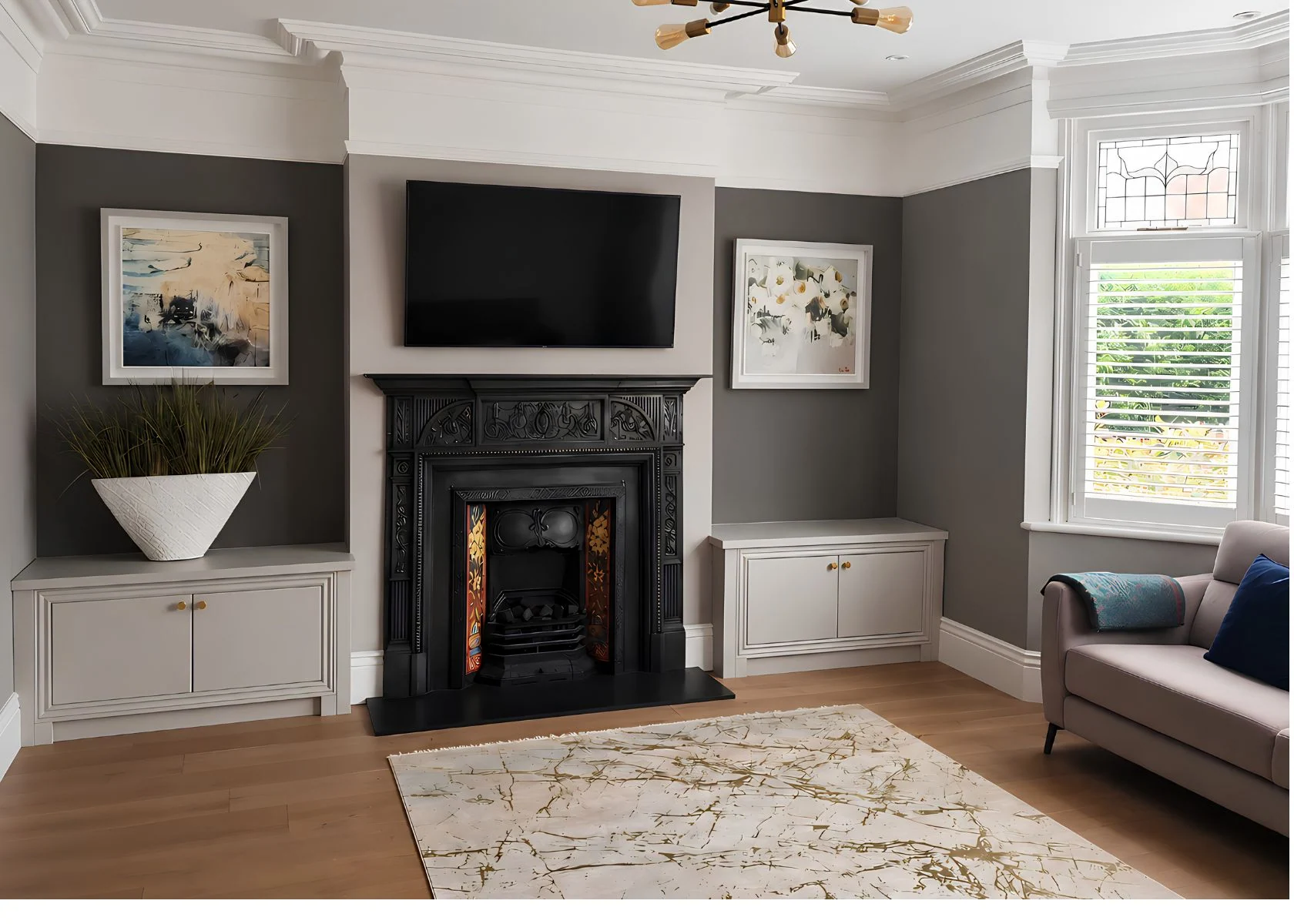 Sutton: Living-room joinery arranged around the existing fireplace.