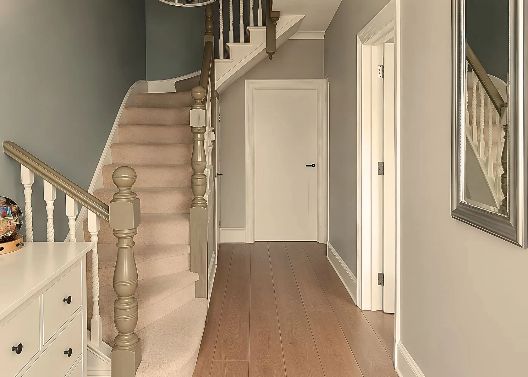 Sutton: The hallway and staircase linking the floors.