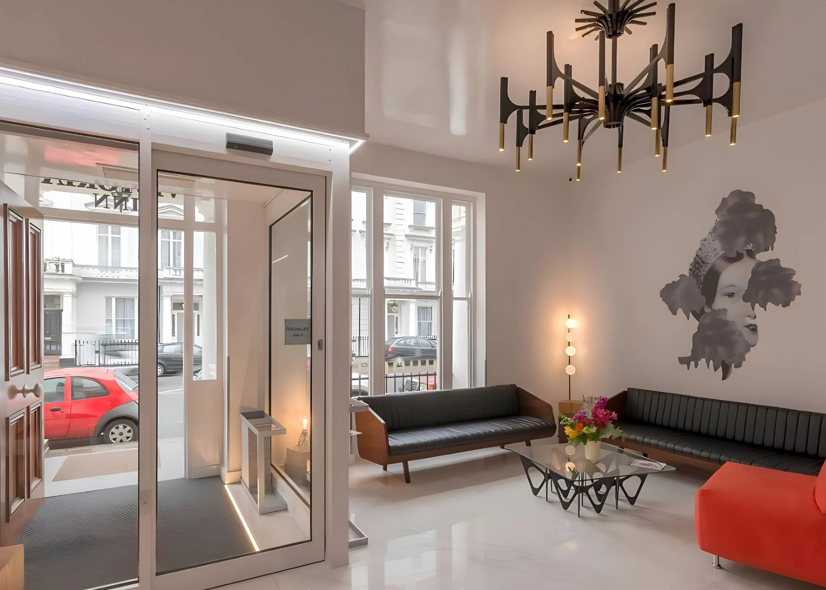 The Victoria Inn reception lounge with tall windows and a view to the street.